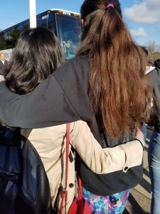 Two girls hugging