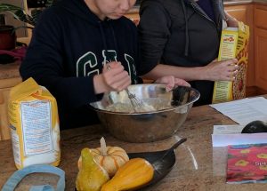 Girl mixing dough in a bowl