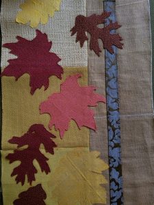 Fusing fall leaves onto quilt