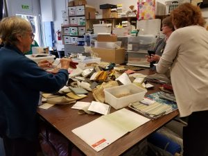 Sorting fabric rescued pieces by size at FabMo