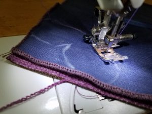 Sewing the edge of textile butterfly