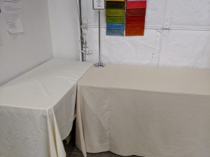 Tables with white tablecloth for a selection event