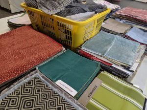 Fabric piles ready for a selection event at FabMo