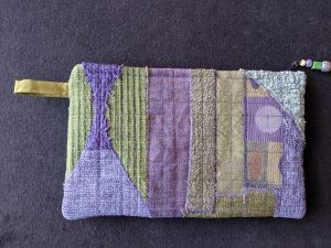 Purple and green zip pouch