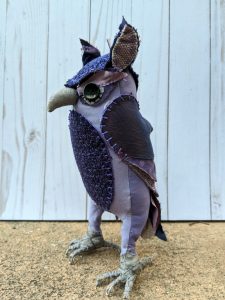 Purple textile owl, side view