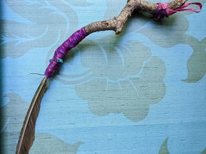 Stick and feather brush