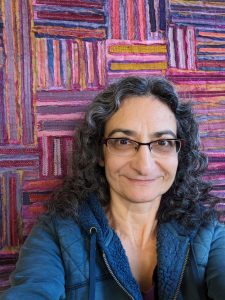Me with close up of finished "Cloth Strokes" art quilt