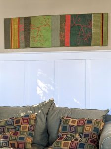 Algae quilt/table runner on the wall