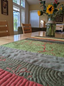 Algae quilt/table runner on the table