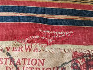 Mended tear in old cloth