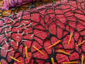 Net stitched onto fabric