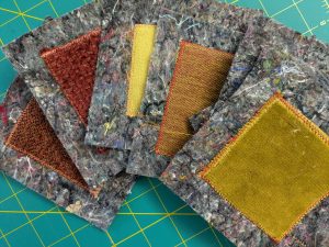 Sewing fabric squares onto shoddy