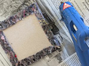 Gluing fabric onto cardboard