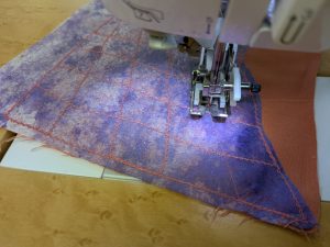 Stitching on painted lutradur
