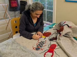 Me working on March to Oblivion art quilt